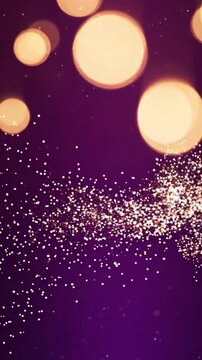 Golden shimmering particles dancing in slow motion against deep purple backdrop creates beautiful abstract background animation for creative digital projects