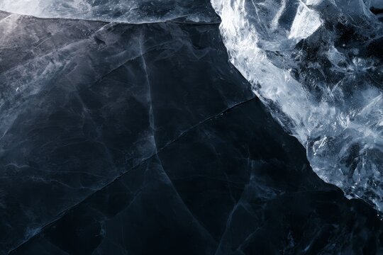 Ice formation close up showing clear and textured patterns in frozen water