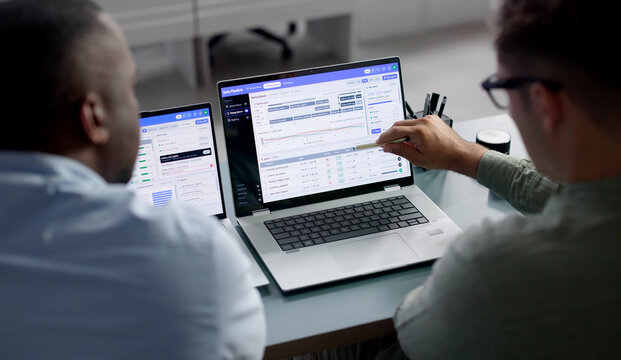 Data Engineer And Colleague Monitor Real-time Workflow Automation Dashboard