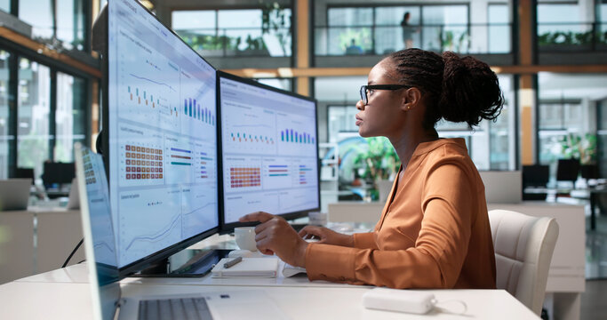 Treasury Manager Analyzes Global Cash Flow Using Laptop