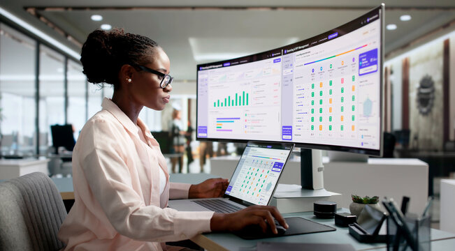 Procurement Manager Reviewing Vendor Proposals On Laptop