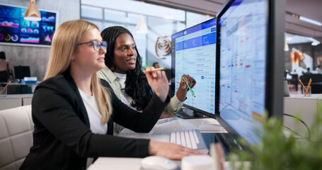 Young Woman Uses Computer To Organize Event Sessions