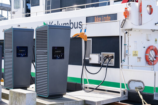August 19, 2026, Haugesund, Norway - Alpitronic charging stations connected to a Kolumbus electric ferry at a dock