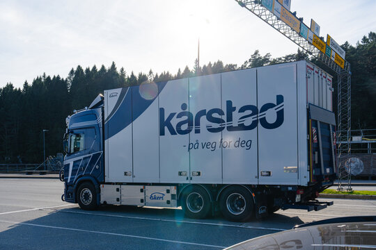 August 19, 2026, Halhjem, Norway - K&aring;rstad transport truck with Ekeri trailer on a road under highway signs