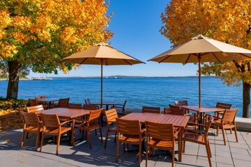 Fototapeta premium Outdoor restaurant patio with lake view during autumn
