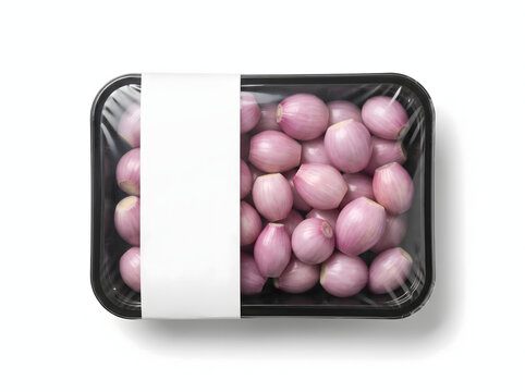 Fresh shallots in a black plastic tray with a blank white label isolated on white