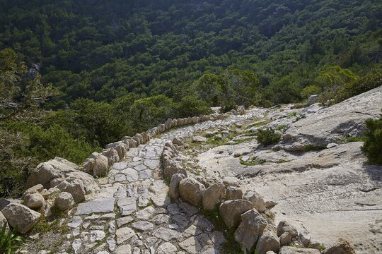 Winding, stony path through a forest full of rocks, Kastro Monolithou, Monolithos Castle, rock castle, Monolithos village, Rhodes, Dodecanese, Greek Islands, Greece