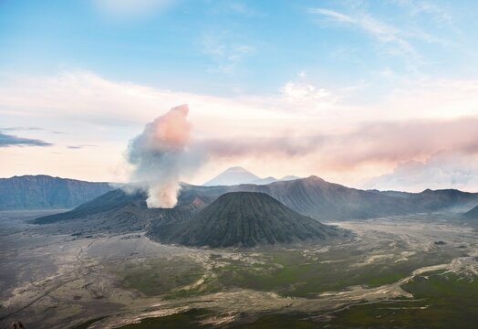 View of volcanoes at sunset, smoking volcano Gunung Bromo, Batok, Mt. Kursi, Gunung Semeru, National Park Bromo-Tengger-Semeru, Java, Indonesia