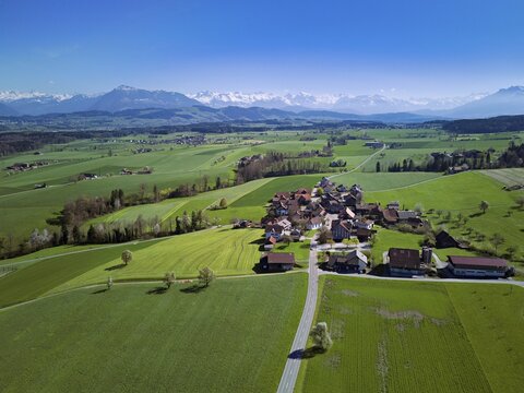 View of the hamlet of Alikon, with the Alps with the Rigi and Pilatus in the back, Sins, Freiamt, Aargau Canton, Switzerland