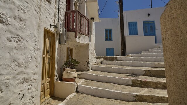 White stone steps lead through a traditional Greek road landscape, Plaka, main town on Milos, Milos island, volcanic island, Cyclades, Greek Islands, Greece
