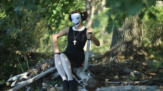 Creepy character with saw for Halloween in spooky forest
