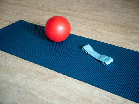 Exercise mat with fitness ball and resistance band for home workout
