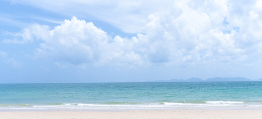 Deep blue sea with blue sky and thin fluffy clouds taken at the sea and beach in Krabi South of Thailand used as blue natural background texture