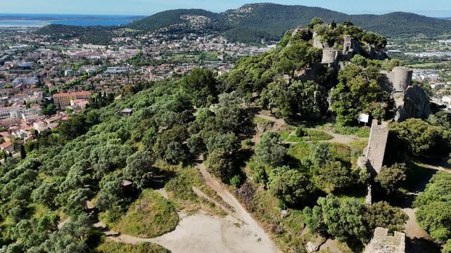 Aerial view of Chateau d'Hyeres castle ruins, Provence-Alpes-C&ocirc;te d'Azur, French Riviera, France, Europe. Medieval castle ruins of Chateau d'Hy&egrave;res on a hill overlooking the city and the Mediterranean