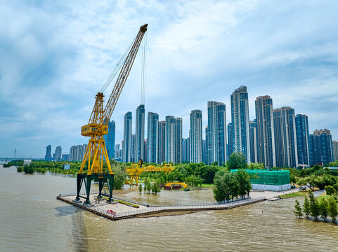 Yellow Crane and Skyscrapers Along Flooded Yangtze River, China