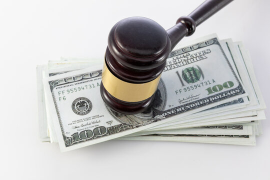 Judge Gavel on US Dollar Banknotes Representing Legal Fees and Financial Justice
