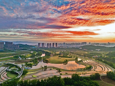 Yichang Wetland Sunset with City Skyline and Water Reflections