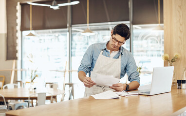 Man, paperwork and small business owner in restaurant with laptop, hospitality and supplier...