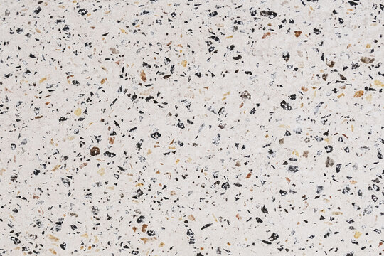 Terrazzo texture featuring a natural speckled surface with scattered stone chips, subtle tonal variation, and a durable architectural finish. Ideal for flooring, walls, countertops, tiles, interiors, 