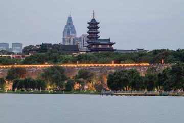 Fototapeta premium Historic Pagoda and City Wall at Xuanwu Lake, Nanjing at Dusk