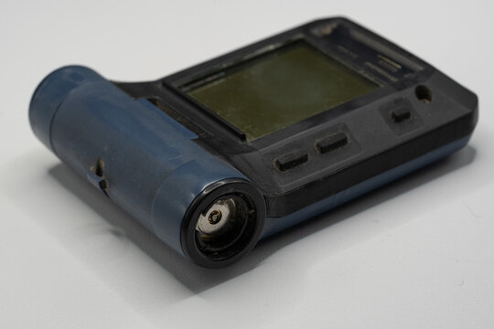 Emergency pager alarm receiver device close up on white background