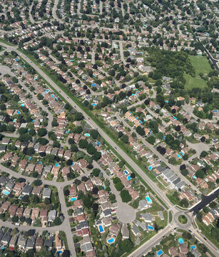 Aerial view of a sprawling suburban neighborhood with houses