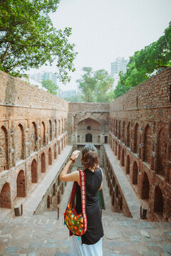 Portrait of a young Indian woman exploring Delhi at Connaught Place, Agrasen Ki Baoli and Chandni Chowk