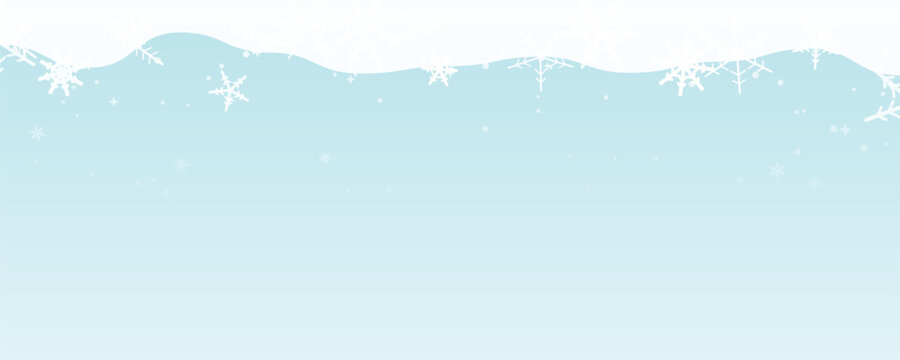 Gentle snowfall drifts across a pale blue winter sky with delicate white flakes creating a serene atmosphere