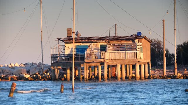 Historic wooden house on stilts by the water