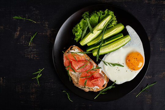 Balanced Protein Breakfast with Salmon Egg Cucumber and Greens. Top view