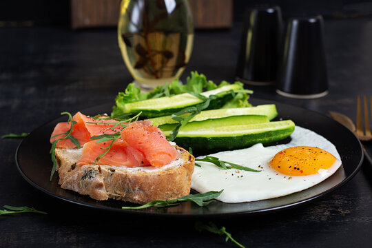 Healthy Morning Meal with Smoked Salmon Sandwich and Fried Egg