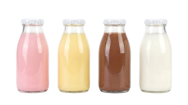 Four glass milk bottles with flavored milk drinks arranged in a row isolated element on transparent background