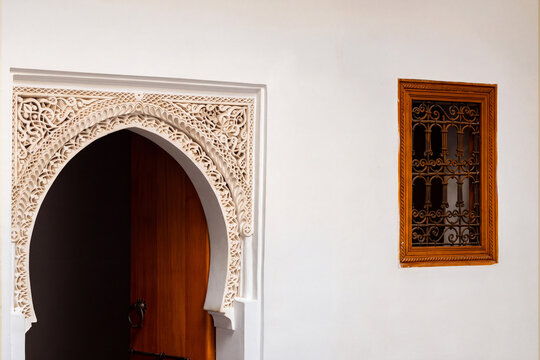 Exquisite Moorish Architecture: Ornate Carved Stucco Archway in the Marrakech Medina