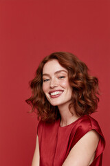 Fototapeta premium happy young woman with wavy auburn hair and freckles, smiling redheaded woman with natural beauty, cheerful slim woman with auburn hair and youthful freckles