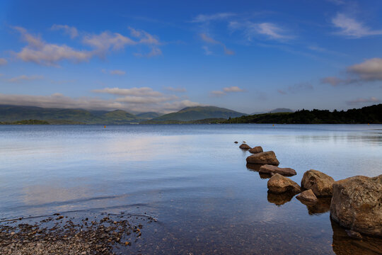 Tranquil morning on the banks of Loch Lomond in the Loch Lomond and the Trossachs National Park in Scotland.