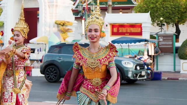 Traditional Thai Khon Dancers Perform in Front of Wat Suthat Temple