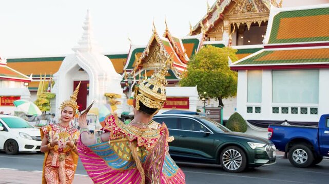 Traditional Thai Khon Dancers Perform in Front of Wat Suthat Temple