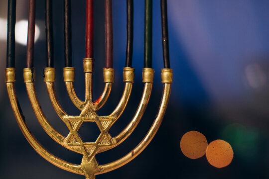 Hanukkah menorah displaying star of david and candles