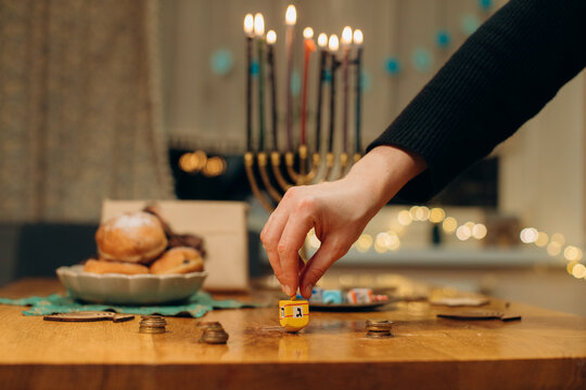 Celebrating hanukkah with dreidel, menorah, and sufganiyot