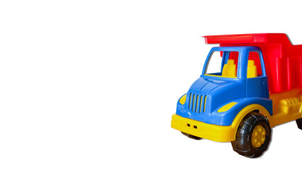 Colorful toy dump truck isolated on transparent background, plastic vehicle PNG cutout. © Анна Трегубова