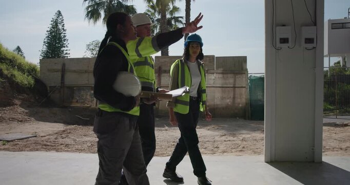Construction, team or clipboard for site inspection, compliance audit or renovation progress. People, architect or subcontractor with building visit for remodeling quality, punch list or phase check
