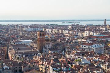 Obraz premium Aerial view of Venice's red-tiled rooftops overlooking the Grand Canal and lagoon