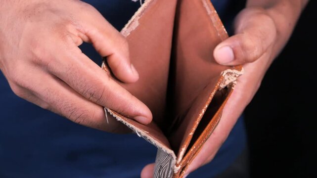 Man hands showing an empty wallet financial crisis bankruptcy no money poor man concept economic problem slow motion video clip
