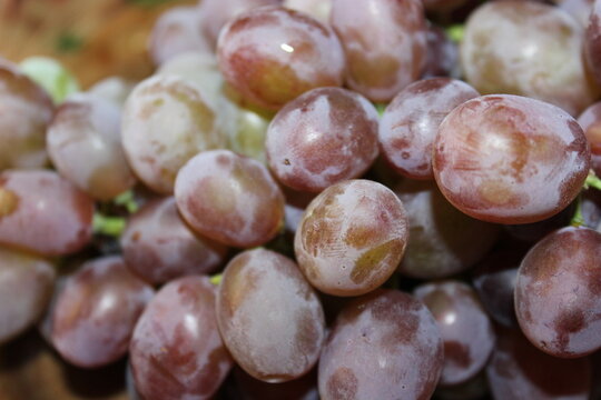 A bunch of grapes on the table