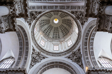 Low angle view from the interior of Brescia Cathedral looking up at the central dome, in a late Baroque and Neoclassical style © Ldgfr Photos