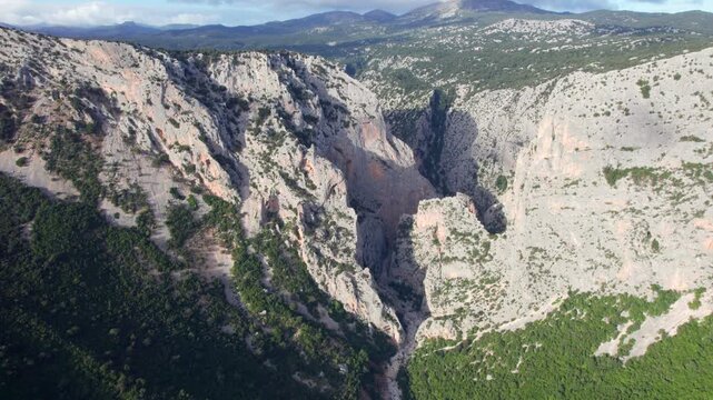 Majestic aerial view of the deep Gorropu Gorge, one of Europe's deepest canyons, located in the Supramonte mountain range in Sardinia