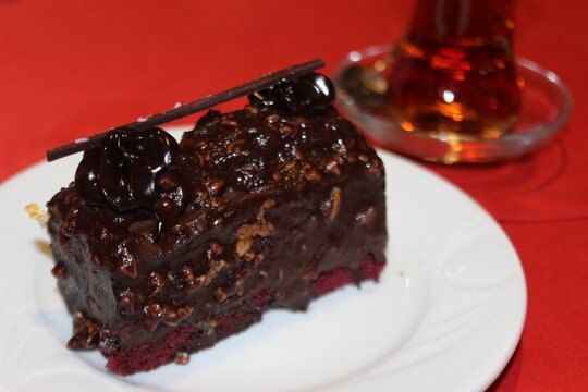 piece of chocolate cake with cherries