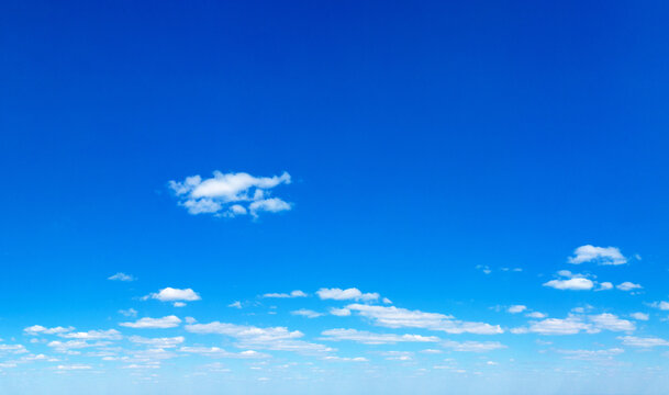 Blue Sky background with tiny Clouds. Panorama background