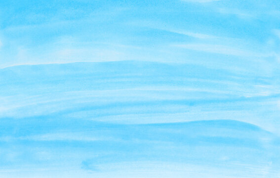 Abstract blue watercolor background. The color splashing on the paper. Hand drawn.