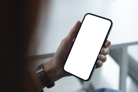 Mockup, woman using mobile phone with white empty screen for mobile app design and online marketing, close up